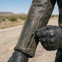 Close-up of a Distressed Leather Jacket and gloves.