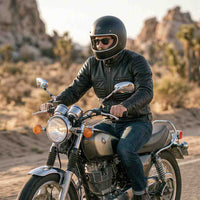 A person riding black leather motorbike jacket on street