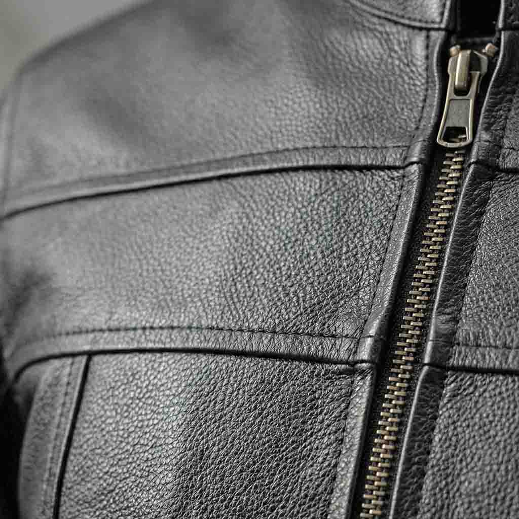Close-up of a black motorcycle leather jacket with a zipper