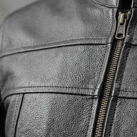 Close-up of a black motorcycle leather jacket with a zipper